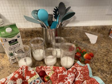 morning smoothies | Angelman Syndrome News | Sabrina's "assembly line" for making smoothies in the kitchen includes a carton of coconut milk, strawberries, and other items. 