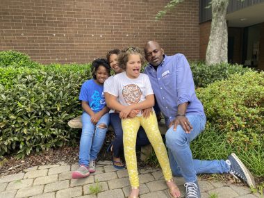 Angelman | Angelman Syndrome News | Juliana poses with her family on the last day of school.